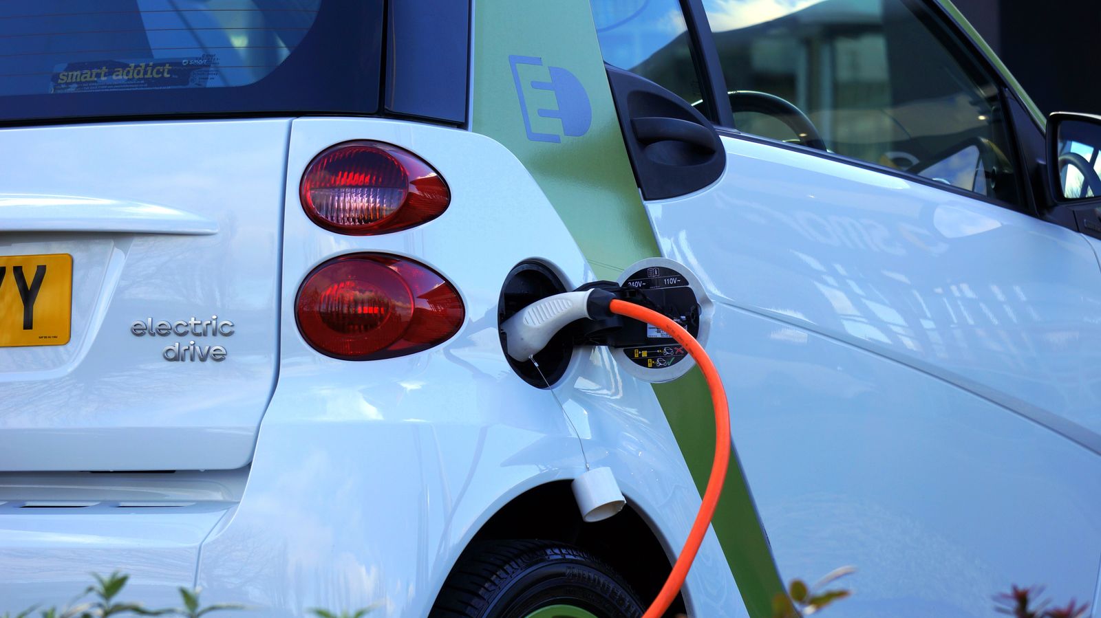 Electric and hybrid cars on a road